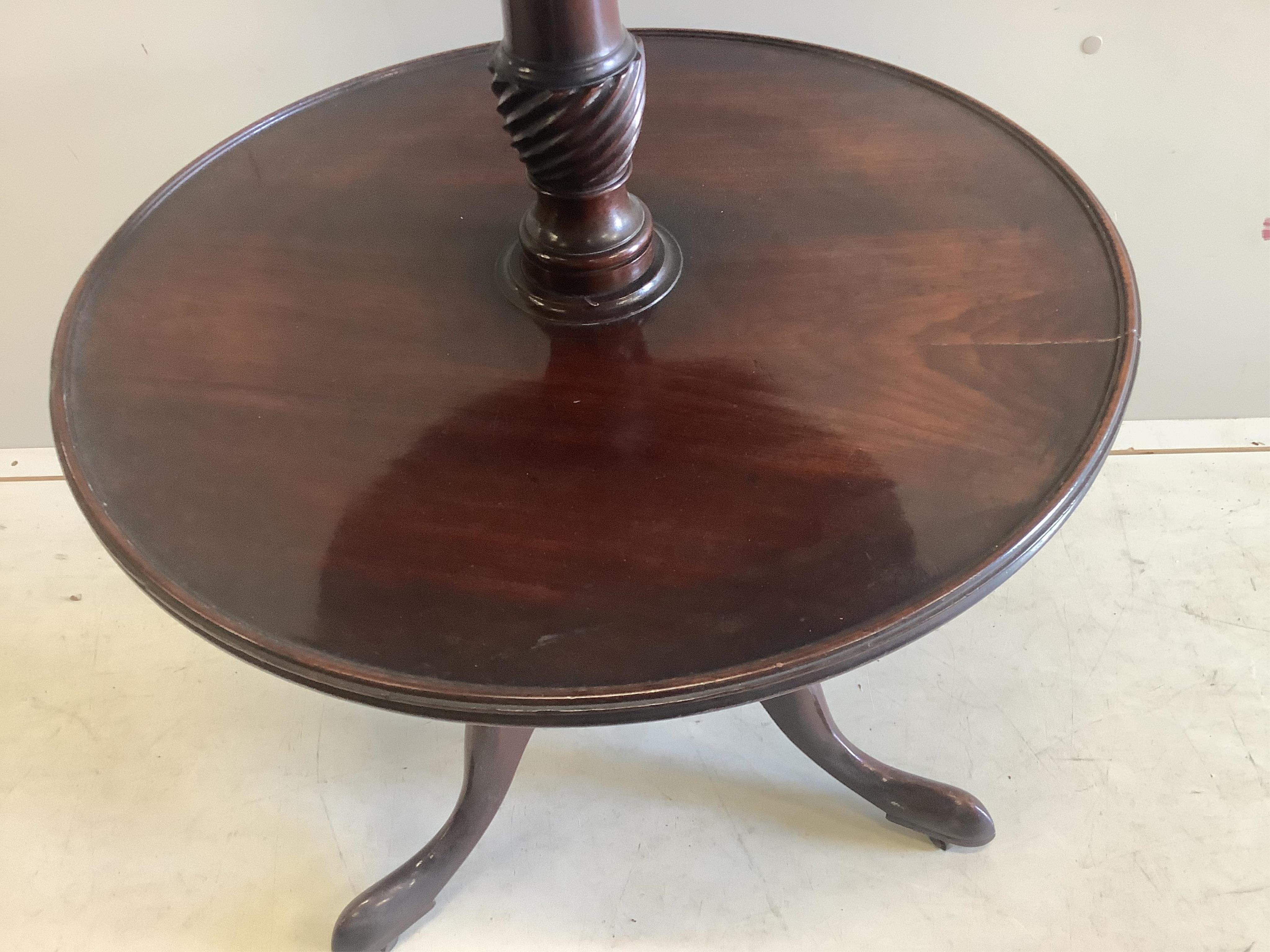 An early 19th century mahogany three tier dumb waiter, diameter 62cm, height 120cm